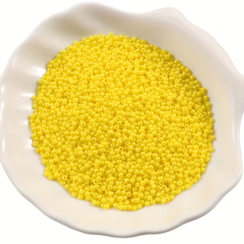 OJOS ABALORIOS AMARILLOS 2mm + 100 ALFILERES