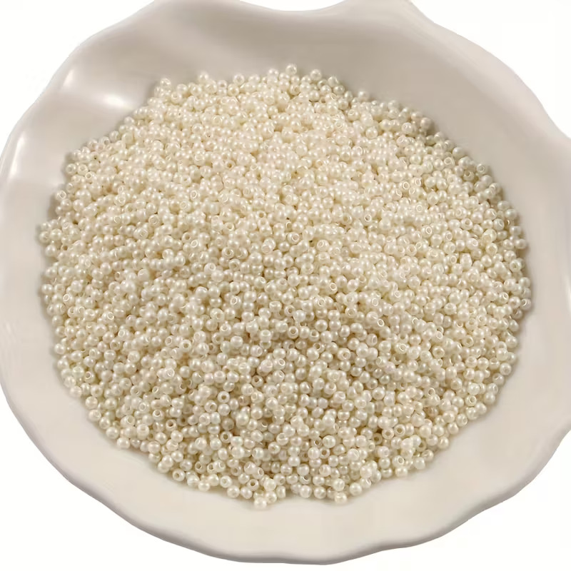 OJOS ABALORIOS BLANCOS 2mm + 100 ALFILERES